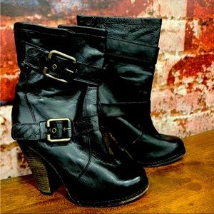 Aldo black high heeled boots.